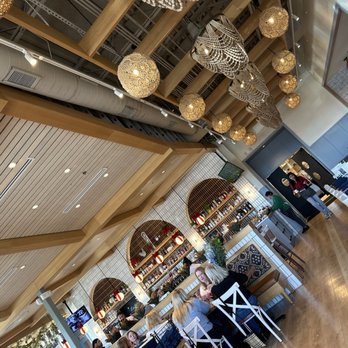 Tupelo Honey Southern Kitchen & Bar - Walkway as well as full stocked Bar!!! - New American Near Me - Irving, Texas