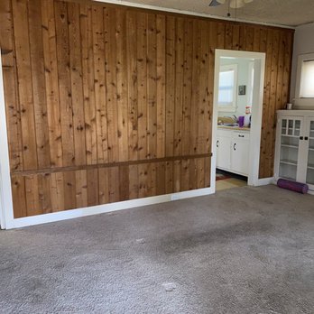 WIC Construction Services - living room (before). narrow kitchen opening. - General Contractors Near Me