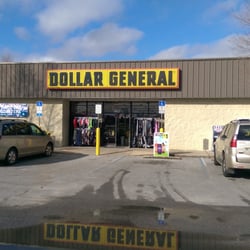 Dollar General - The front of the store. Parking lot lake in the foreground.