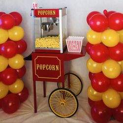 Penny Pinching Party Planning - Popcorn machine and mini balloon columns
