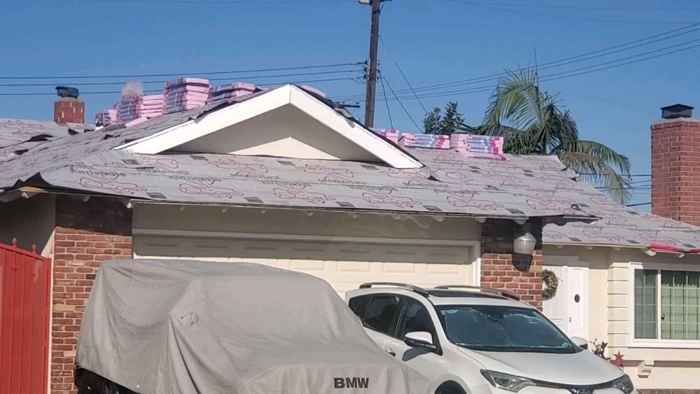 Slide of Mikes Roofing