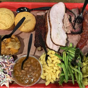 Terry Black's Barbecue - Turkey, jalapeño sausage, brisket, and pork ribs with single serving size of coleslaw, pinto beans, Mac n cheese, green beans, and pickles. - Barbeque Near Me - Austin, Texas Terry Black's Barbecue - Turkey, jalapeño sausage, brisket, and pork ribs with single serving size of coleslaw, pinto beans, Mac n cheese, green beans, and pickles. - Barbeque Near Me - Austin, Texas