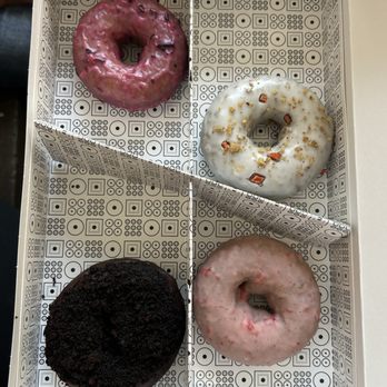 Doughnut Plant - Clockwise: summer berry, carrot cake, strawberry, blackout - Donuts Near Me - New York, New York Doughnut Plant - Clockwise: summer berry, carrot cake, strawberry, blackout - Donuts Near Me - New York, New York