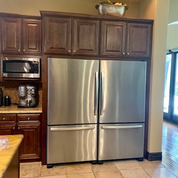 Majestic Cabinets - BEFORE: Short refrigerators, large traditional cabinets above, poorly designed frame around units. - Cabinetry Near Me - Las Vegas, Nevada Majestic Cabinets - BEFORE: Short refrigerators, large traditional cabinets above, poorly designed frame around units. - Cabinetry Near Me - Las Vegas, Nevada