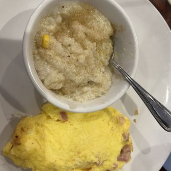 Brick And Spoon - Pigeon Forge - Grits with fire roasted corn, topped with raw sugar, and three cheese and ham omelet - Breakfast & Brunch Near Me - Pigeon Forge, Tennessee Brick And Spoon - Pigeon Forge - Grits with fire roasted corn, topped with raw sugar, and three cheese and ham omelet - Breakfast & Brunch Near Me - Pigeon Forge, Tennessee
