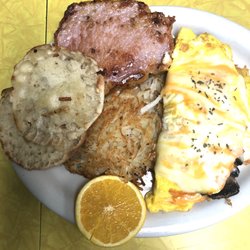 The Full Cup - Cheese Omelette add mushrooms, shredded hashbrowns, hand cut peameal STEAK & subbed english muffin. Best breakfast at a restaurant 10/10!