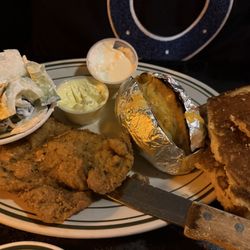 Gerst Bavarian Haus - Weiner schnitzel (extremely tender veal), cucumber onion salad, loaded baked potato, served with cornbread.