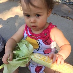 Garden of Eden - Shucking corn for National Farmers Day!!