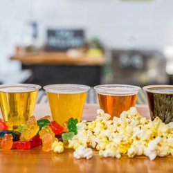 Blue Dogwood Public Market - Find beer flights, gummy bears, and popcorn at The Bar.
