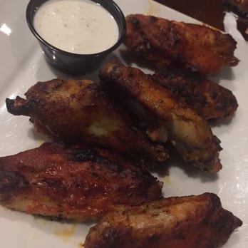 Pies & Pints - Char-grilled wings: dry rubbed and marinated in sriracha sauce, citrus, garlic & cilantro. Served with creamy Gorgonzola. - Pizza Near Me - Charleston, West Virginia Pies & Pints - Char-grilled wings: dry rubbed and marinated in sriracha sauce, citrus, garlic & cilantro. Served with creamy Gorgonzola. - Pizza Near Me - Charleston, West Virginia
