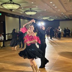 Arthur Murray Dance Studio - Leslie and her instructor Andrew dancing at our District showcase.