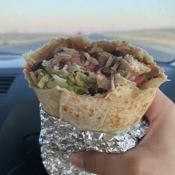 Baja Fresh - a hand holding a burrito - Fast Food Near Me - Coalinga, California Baja Fresh - a hand holding a burrito - Fast Food Near Me - Coalinga, California