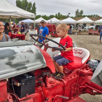 Corrales Growers Market - Tractor driver negotiating the slalom course - Farmers Market Near Me - Corrales, New Mexico
