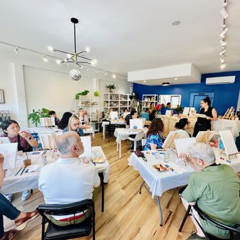 The Wellest - Non-alcoholic Sip & Paint event guests listen to instructor's guidance at The Wellest (June 2024) - Beverage Store Near Me - Long Beach, California