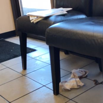 Grease Monkey - Dirty rag and something brown on the floor. Magazines all over the chairs. Filthy floor. - Auto Repair Near Me - Centennial, Colorado