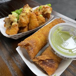 Soupa Saiyan - Philly egg roll and chicken wings. The green sauce is amazing !
