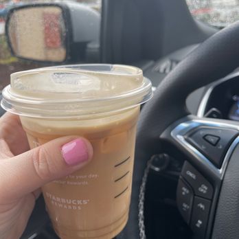 Starbucks - a hand holding a cup of coffee - Coffee & Tea Near Me - Snohomish, Washington
