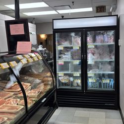 Han Kook Meat Trading Ltd. - The fridge at the back with thinly cut bags of meat.