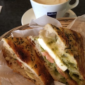 Café Rustica - Tomatoes and fresh mozzarella with pesto on focaccia.  A cup of soy latte. - Coffee & Tea Near Me - Somerville, Massachusetts