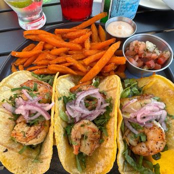 Harbor Bistro & Lounge - Harbor Tacos (shrimp) with sweet potato fries, pico de gallo, and a chili aioli - Breakfast & Brunch Near Me - Venice, Florida Harbor Bistro & Lounge - Harbor Tacos (shrimp) with sweet potato fries, pico de gallo, and a chili aioli - Breakfast & Brunch Near Me - Venice, Florida