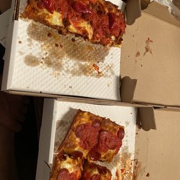 Cheesy, greasy goodness. The Detroit style are cooked in rectangular "motor oil" pans. Cheesy, greasy goodness. The Detroit style are cooked in rectangular "motor oil" pans.