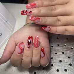 Happy Nails and Spa - Coffin red nails with diamond cross and designs