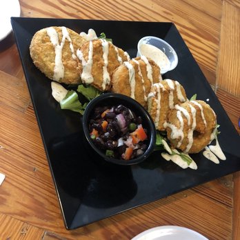 The Blue Hen Cafe - Fried green tomatoes with a cilantro buttermilk dressing complimented with black bean salsa - Southern Near Me - Saint Augustine, Florida
