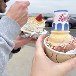 Kell's Kreme - Strawberry shortcake sundae with pistachio ice cream Vanilla chocolate twist with rainbow sprinkles in a cup w/ cone