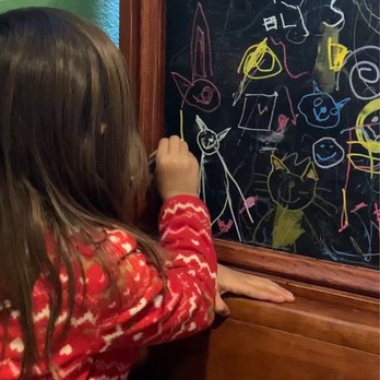 Bailey’s Irish Pub - Inside - awesome chalkboards at the booths - American Near Me - Leavenworth, Kansas