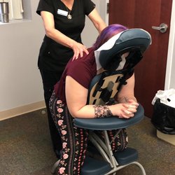 Carolina School Of Massage & Wellness Center - Instructor Ingrid Harris was giving a chair massage to a client at a recent corporate event.