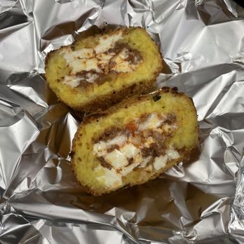 Rosario's - arancini (rice ball) with meat cheese and sauce filling - SLAPS! , as the kids today would say - Delis Near Me - Astoria, New York Rosario's - arancini (rice ball) with meat cheese and sauce filling - SLAPS! , as the kids today would say - Delis Near Me - Astoria, New York