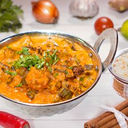 Mumbai House - okra cooked with potatoes, onions, tomatoes, coconut milk & spices. served with a side of rice