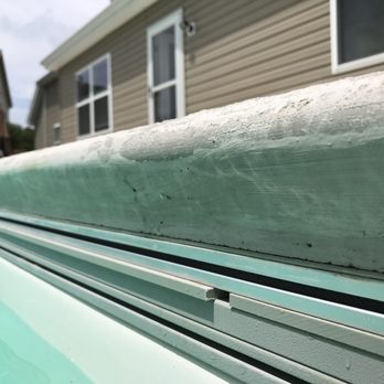 Outdoor Systems Columbia - Track of auto cover popping out due to improper flatwork installation. - Columbia, Illinois