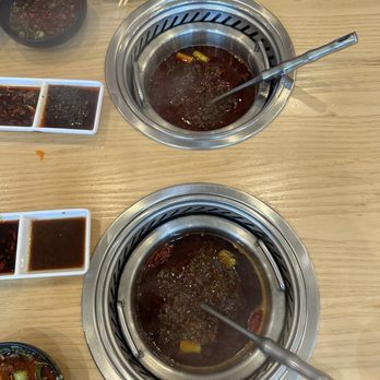 Mumu Hot Pot - Top: Buttery Spicy Soup, Bottom: Sichuan Spicy Soup - Hot Pot Near Me - San Francisco, California