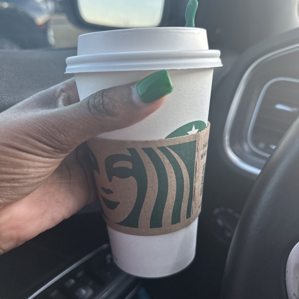 Starbucks - a hand holding a starbucks cup in a car - Coffee & Tea Near Me - Houston, Texas Starbucks - a hand holding a starbucks cup in a car - Coffee & Tea Near Me - Houston, Texas