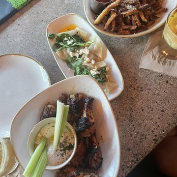 Monkeypod Kitchen by Merriman - Wood - Roasted Chicken Wings Garlic Truffle Oil Fries Taro Ravioli - New American Near Me - Kihei, Hawaii