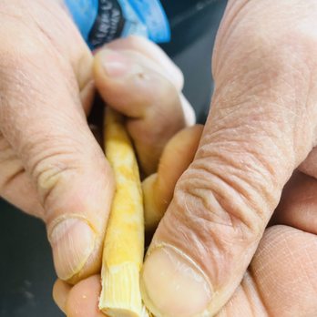 Mediterranean Grocery - a person peeling a banana - International Grocery Near Me - Memphis, Tennessee