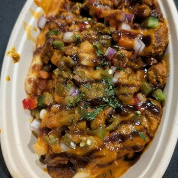 Tandoori Twist - Poutine with lamb, green and tamarind chutney - Indian Near Me - Valley Stream, New York Tandoori Twist - Poutine with lamb, green and tamarind chutney - Indian Near Me - Valley Stream, New York