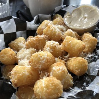 Stray Dog - Garlic tots with Parmesan cheese and garlic aioli - New American Near Me - Minneapolis, Minnesota