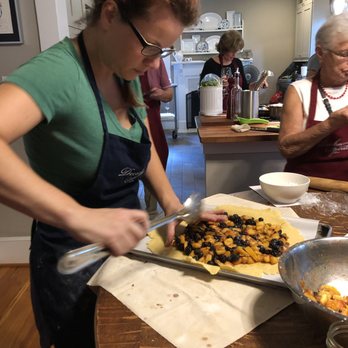 Durham Spirits - Kate finishing up the Peach and Blackberry Crostada with Cornmeal Crust - Cooking Schools Near Me