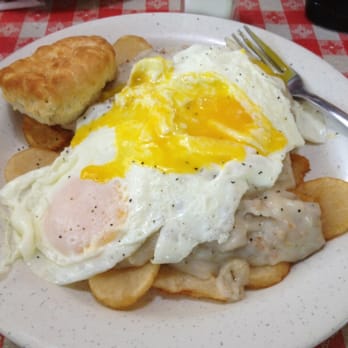 Rooster's Cafe - Home fries topped w sausage gravy, fried eggs and biscuit - Diners Near Me - Brooksville, Florida Rooster's Cafe - Home fries topped w sausage gravy, fried eggs and biscuit - Diners Near Me - Brooksville, Florida