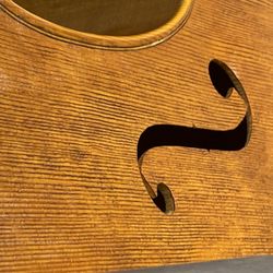 Jim Clinton Violins and Luthier - Top plate detail of wood preparation before varnishing Jim Clinton's 2023 interpretation of the 1865 cello by J B Vuillaume.