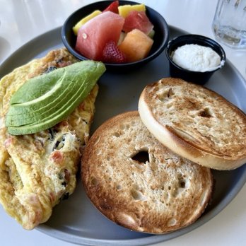 Escena Lounge & Grill - The bacon, avocado and tomato omelet with a side of fruit and a plain bagel - YUMMM! - New American Near Me - Palm Springs, California Escena Lounge & Grill - The bacon, avocado and tomato omelet with a side of fruit and a plain bagel - YUMMM! - New American Near Me - Palm Springs, California