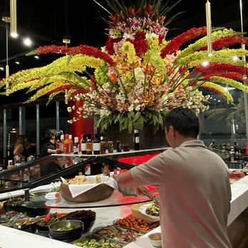 Texas de Brazil - Salad bar with gorgeous flowers on top. - Steakhouses Near Me - Honolulu, Hawaii