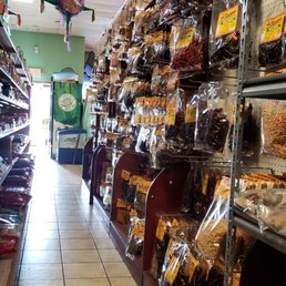 a grocery store aisle filled with goods a grocery store aisle filled with goods