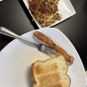 Sunrise Grill & Pizza Restaurant - Breakfast sandwich (eggs, meat, cheese) and hash browns (bacon was stolen from hubby ) - Breakfast & Brunch Near Me - Ormond Beach, Florida