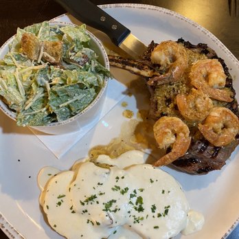 Monica’s Riverview - Ribeye steak with shrimp scampi and side Cesar salad and side Yukon potatoes - Breakfast & Brunch Near Me - Antioch, California Monica’s Riverview - Ribeye steak with shrimp scampi and side Cesar salad and side Yukon potatoes - Breakfast & Brunch Near Me - Antioch, California