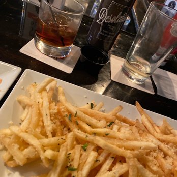 4th West Pub - a plate of french fries and a bottle of whiskey - Pubs Near Me - Escalante, Utah