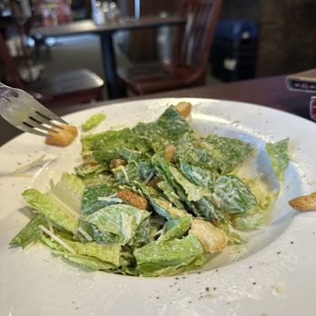 Fat Cat Pizza - A half-eaten Caesar salad. Tom couldn't wait. Very nice dressing and size--very gone. - Pizza Near Me - Strafford, Missouri