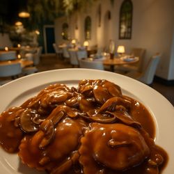 Venezia Pizza and Restaurant - Portobello- stuffed mushrooms ravioli draped in a dark ,silky Marsala with caramelized shallots
